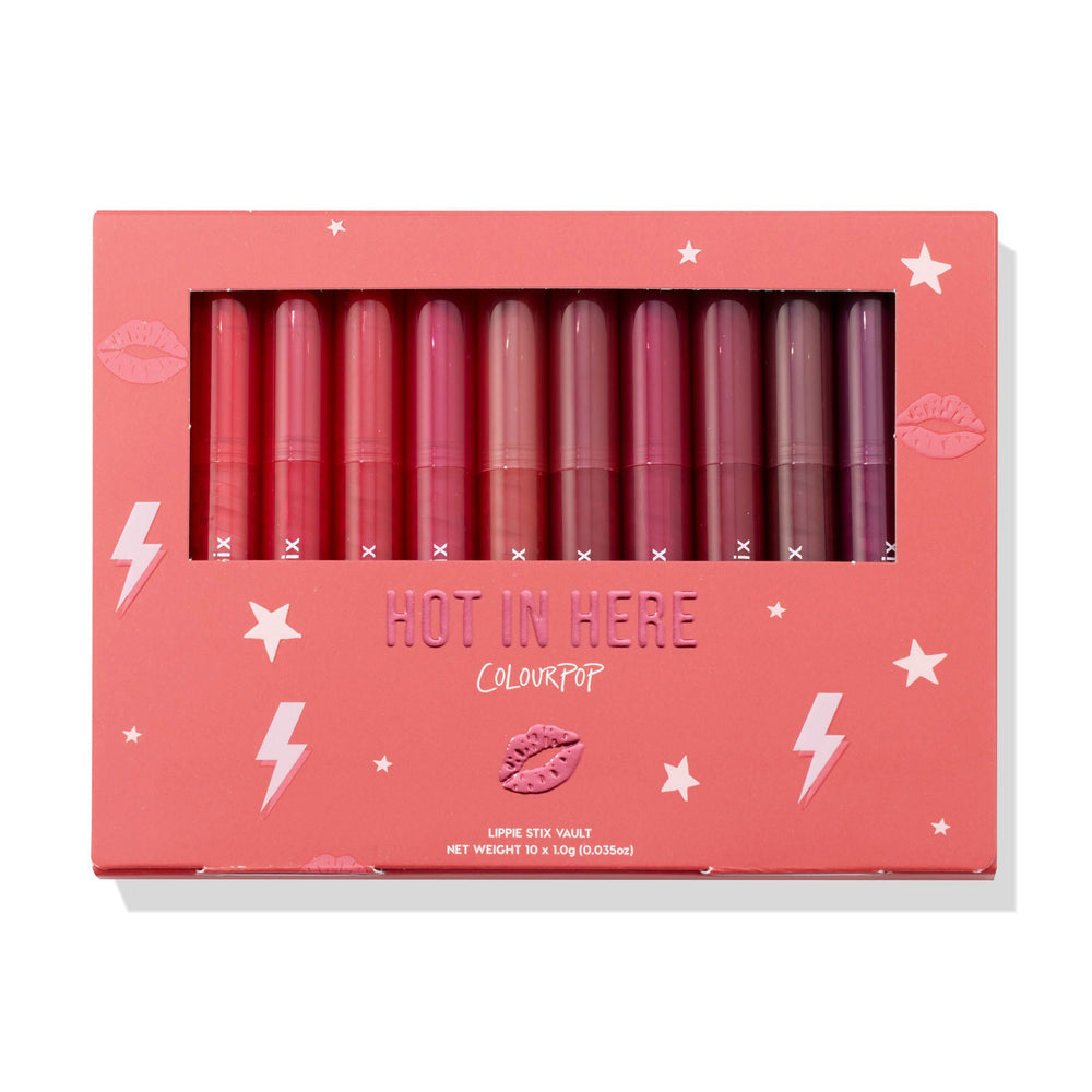 Heat Warning ColourPop Lippie Vault Set showcasing 10 Lippie Stix in gradient shades from bright coral and pink to berry and plum, arranged upright behind a clear window in a coral box labeled 'Hot In Here' with star and lightning graphics.