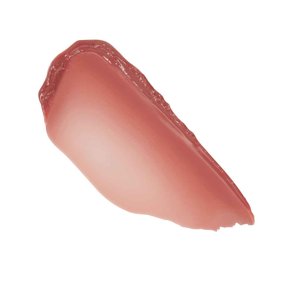 Rosy‑nude gloss swatch gliding diagonally on white, showcasing Vacay Mode and the dewy shine of the ColourPop So Juicy Plumping Gloss Balm with Peptides, a cushiony lip balm with smooth, even payoff.