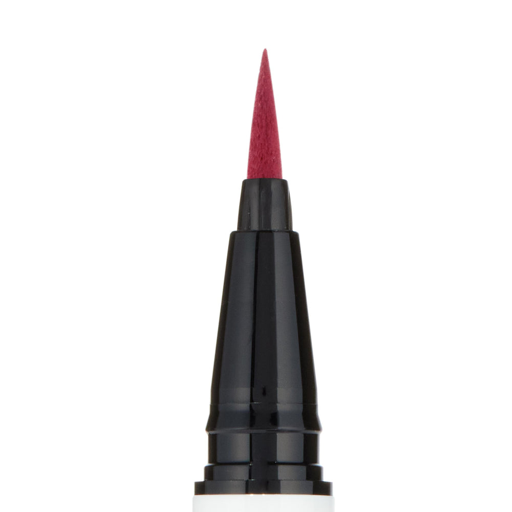 Felt-tip applicator poised to draw crisp lines, macro close-up of the Try Me shade (deep berry red) from the ColourPop BFF Liquid Liner, centered on a black-and-white pen barrel against a white background.